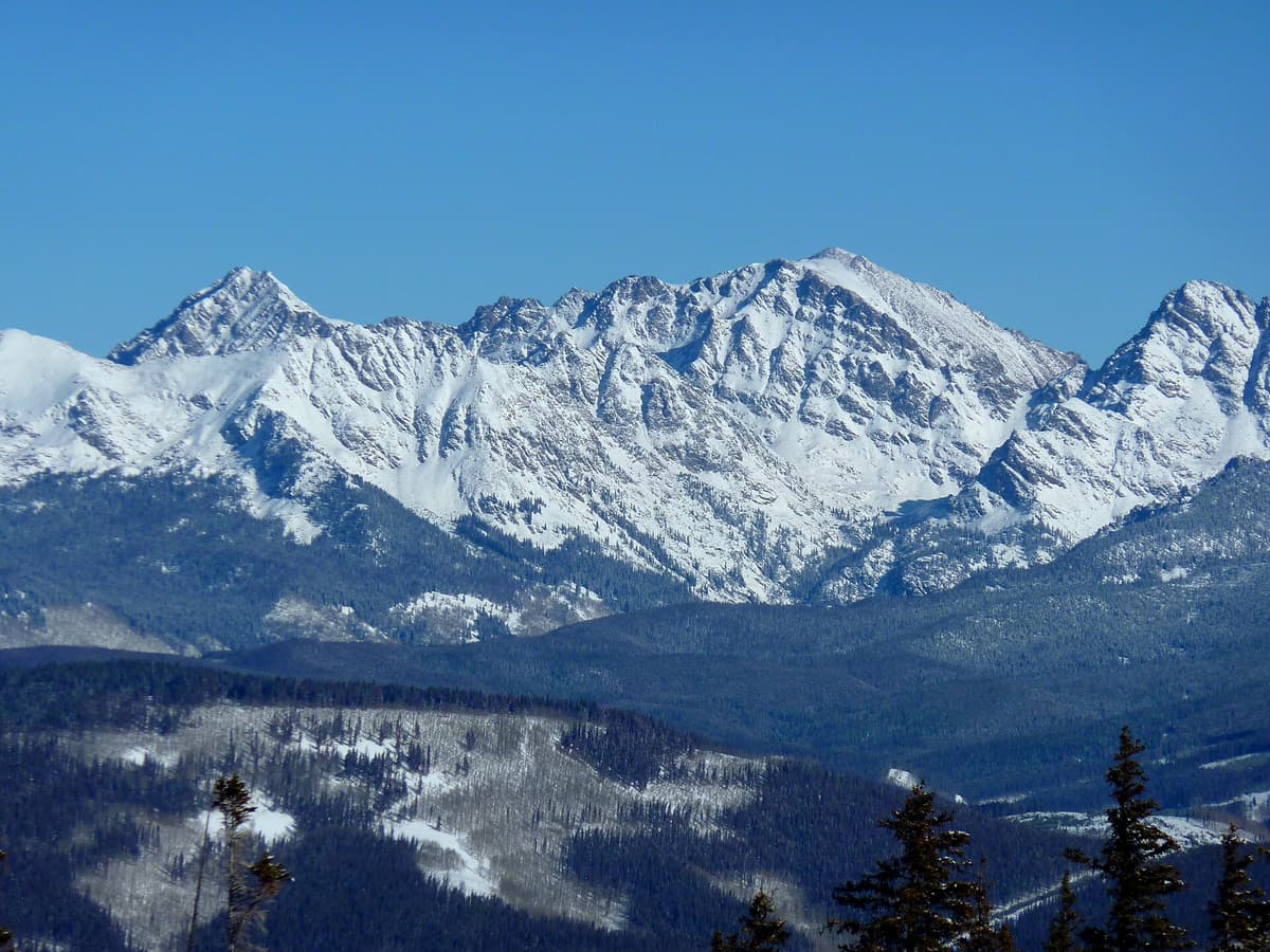 Mount Powell, the highest peak in the Gore Range, rising above the forest north of Vail