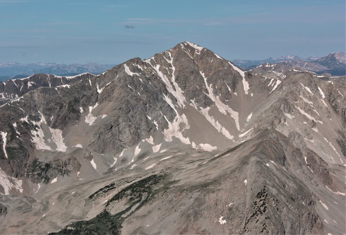 The steep east face of Huron Peak, a 14,003-foot Colorado summit, seen across a valley in the Sawatch Range