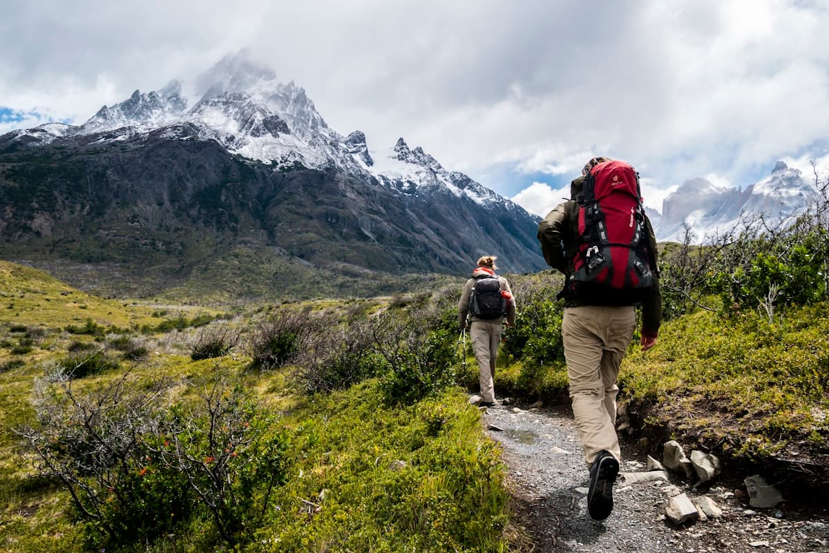 Hiker on a mountain trail in Colorado wearing hiking pants 