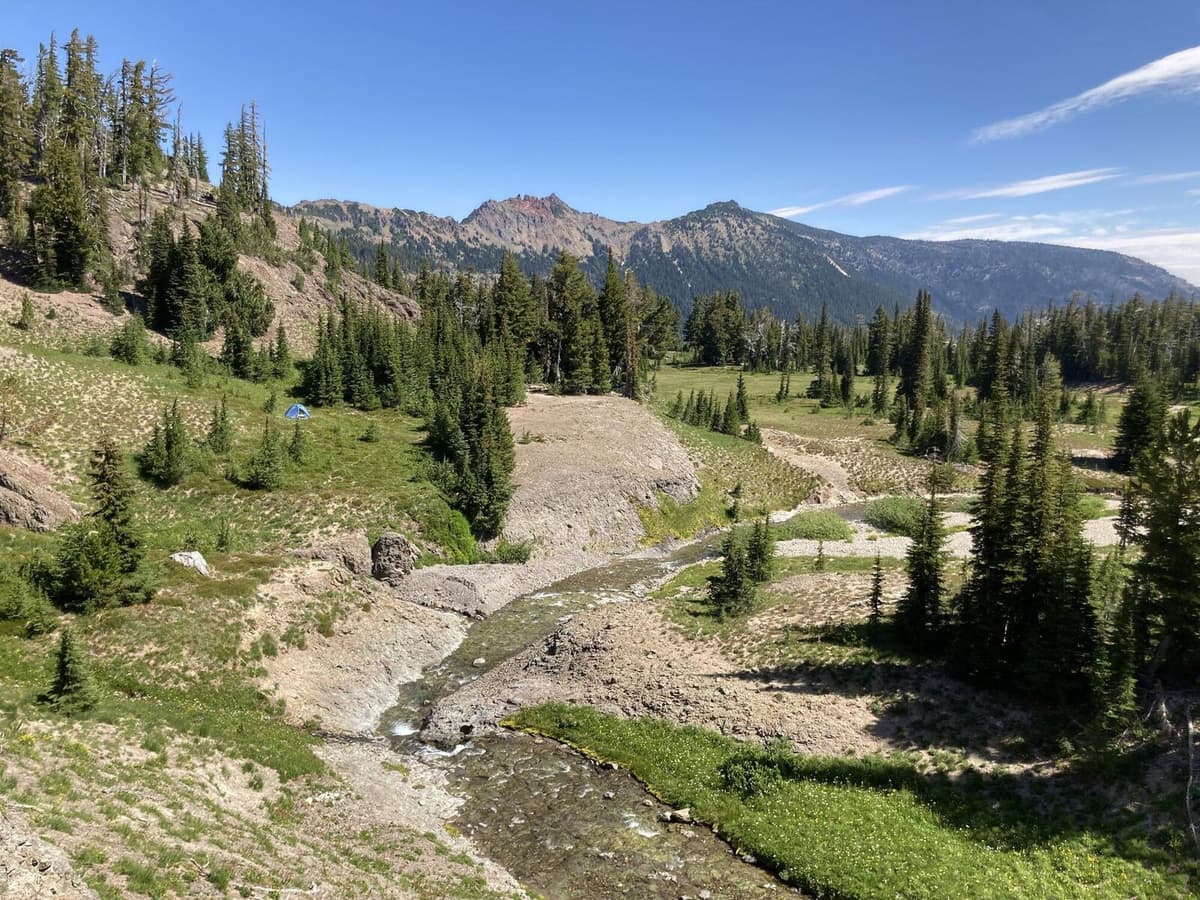 A backpacking tent pitched at a high alpine campsite, the kind of setup you need for a cold night near Conundrum Hot Springs