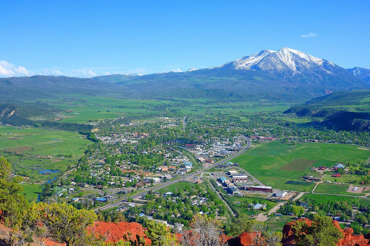 Aerial view of Carbondale, Colorado in the Roaring Fork Valley with snow-capped Mount Sopris rising behind the town