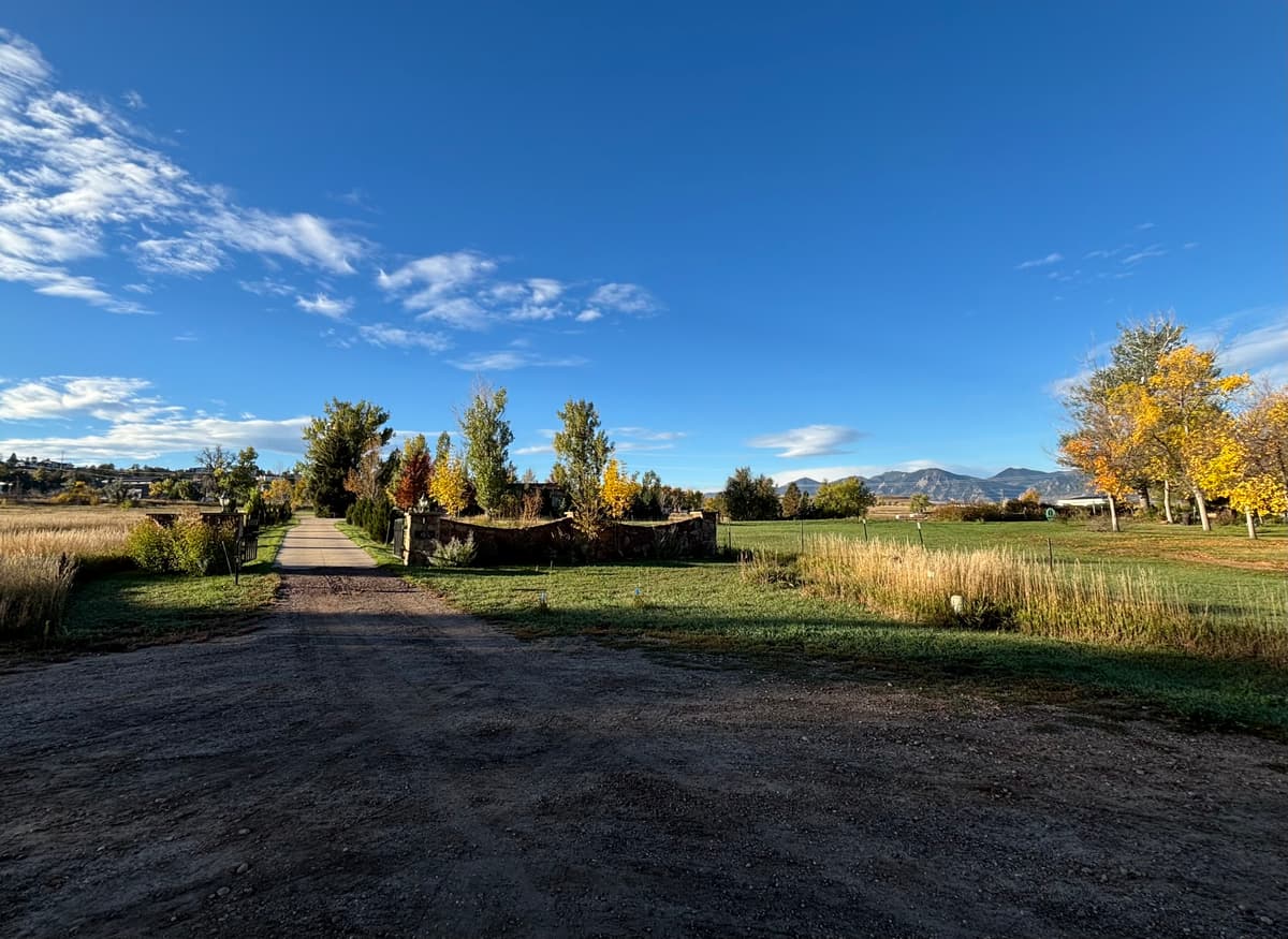 A Boulder County open space path leading toward the Front Range foothills