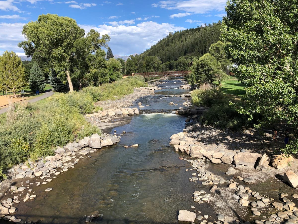 The San Juan River flowing through the center of Pagosa Springs, Colorado, where soaking pools line the banks
