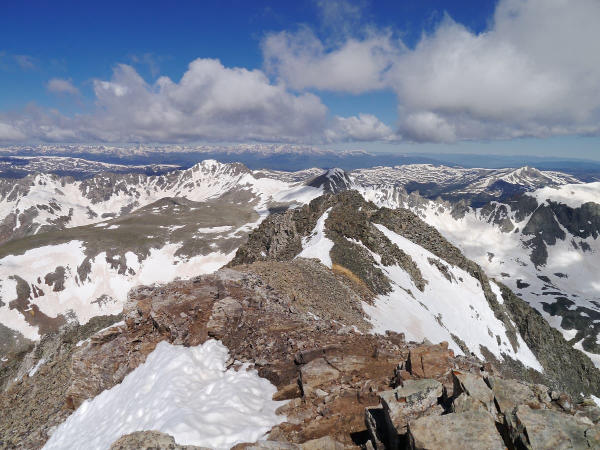 Storm clouds building over a Colorado 14er summit on a summer afternoon
