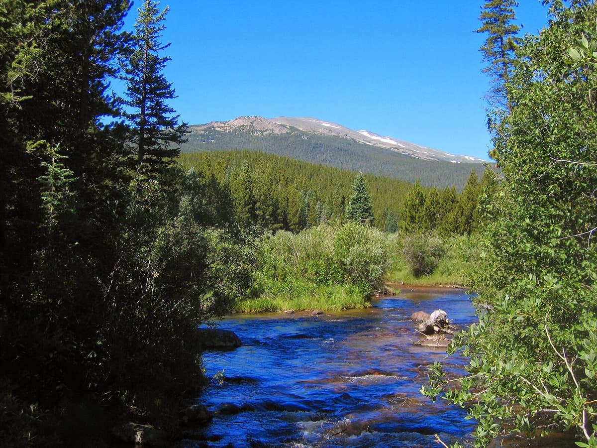 The Mummy Range rising above a stream in Rocky Mountain National Park, the backdrop of Lawn Lake