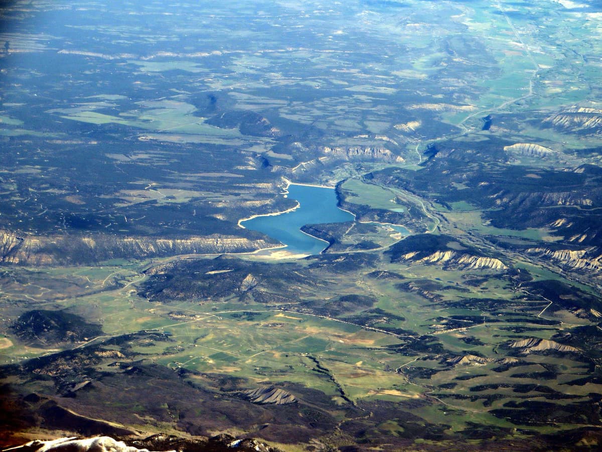 Aerial view of Ridgway Reservoir and Ridgway State Park in the Uncompahgre Valley, a short drive from Orvis Hot Springs
