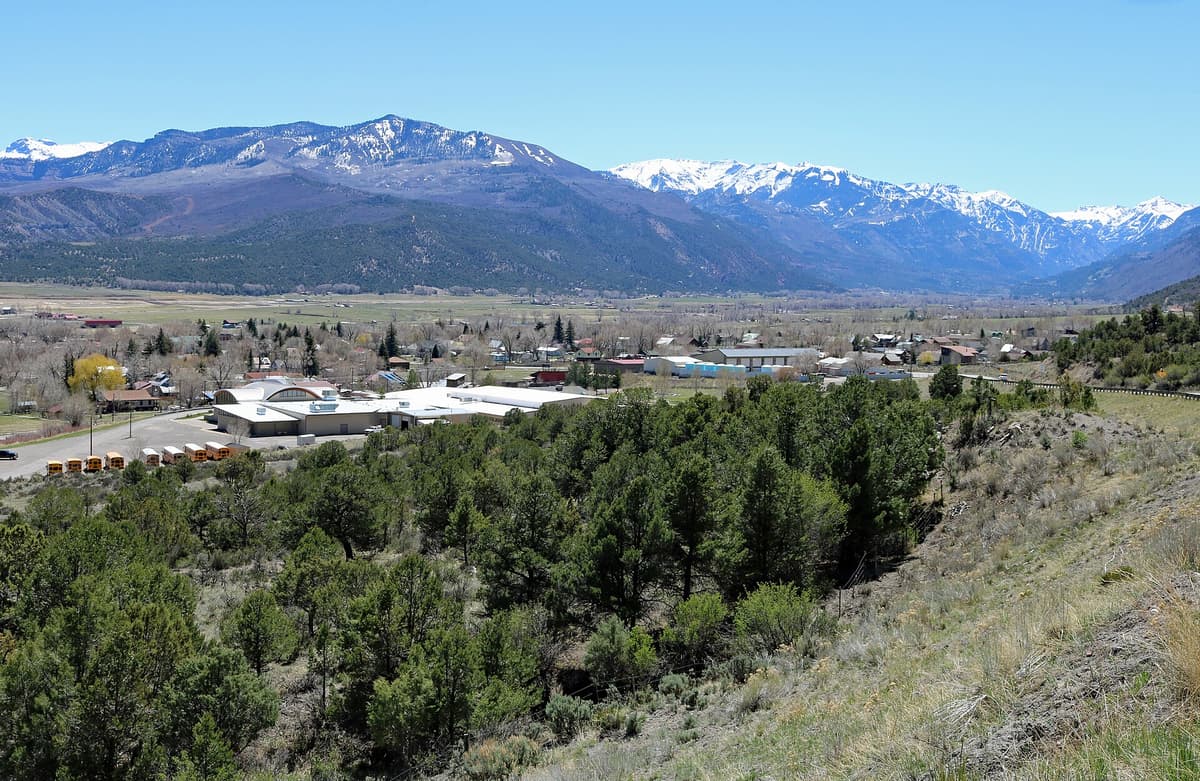 The town of Ridgway in the Uncompahgre Valley with the Sneffels Range behind it, just north of Orvis Hot Springs
